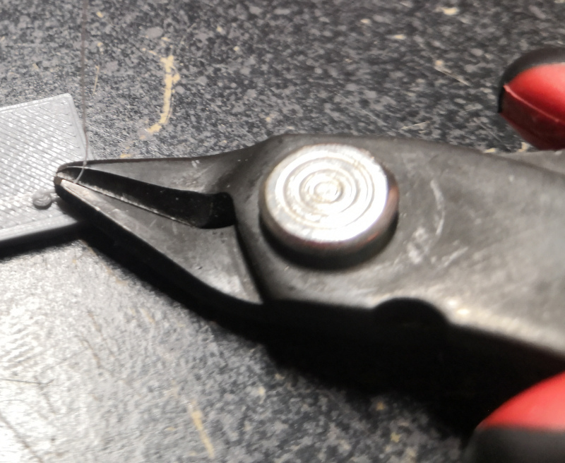 Removing strings with flush cutters