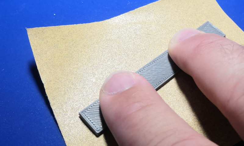 Sanding protrusions on braille dots