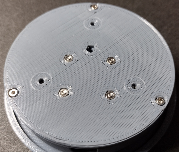 Buttom attached to assembly